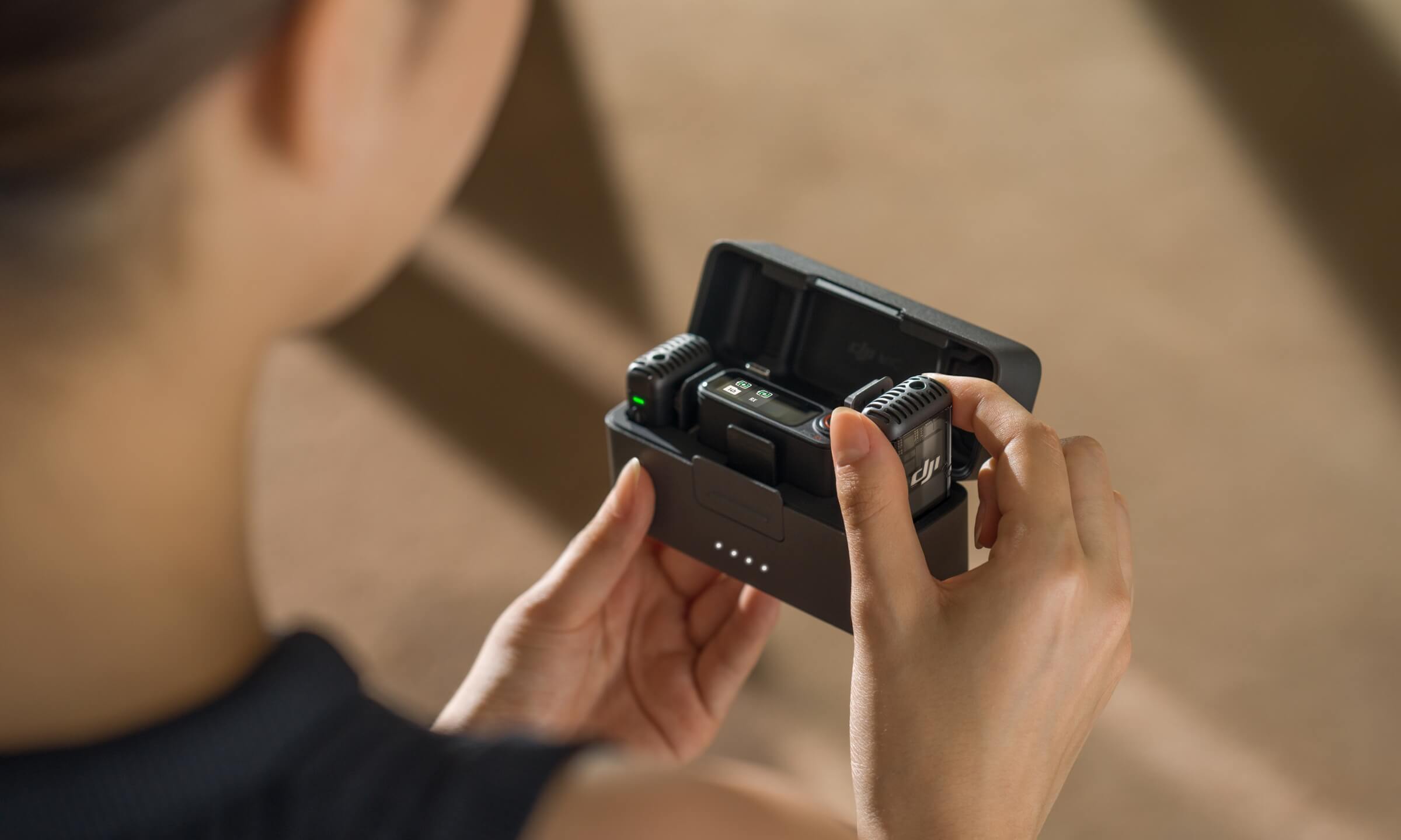 DJI Mic 2 automatically powers on as you open the charging case.
